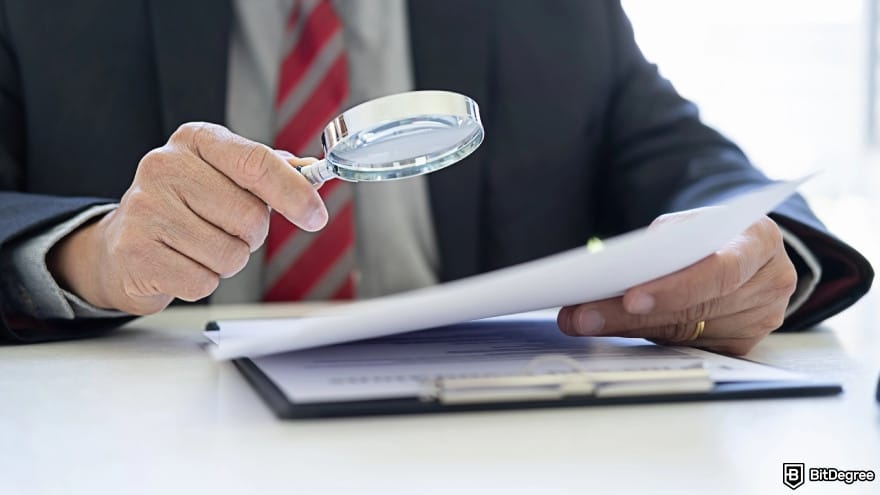 How to send money to Nigeria from USA: a person investigating a document using a magnifying glass.