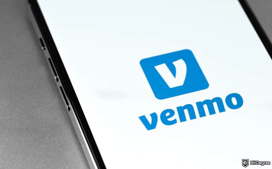 How to send money to someone without a bank account: phone screen showing Venmo logo to illustrate money apps.