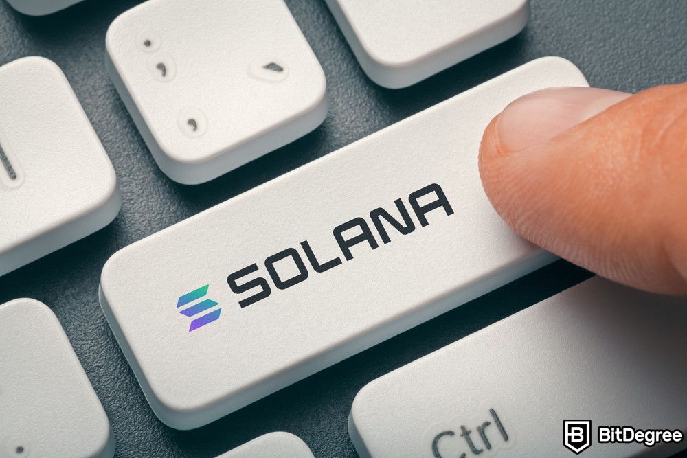 How to stake Solana: a finger pressing a key with Solana text written on it.