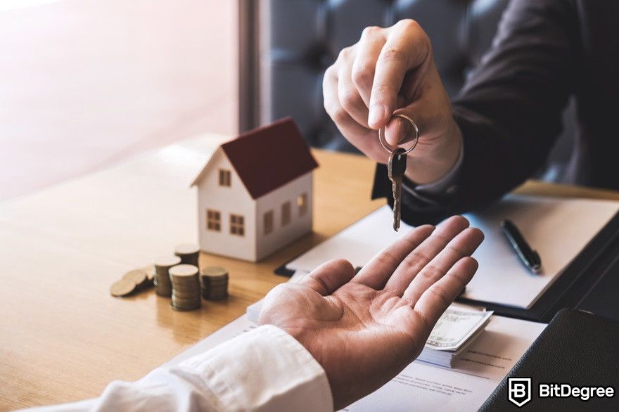 How to transfer crypto to bank account: real estate agent giving a key to client.