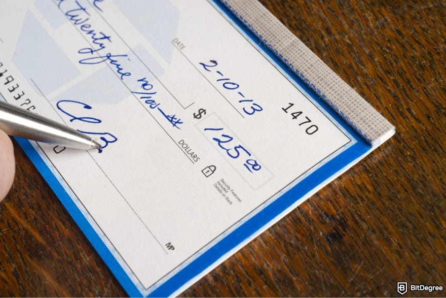 How to transfer money from bank account: writing a check.
