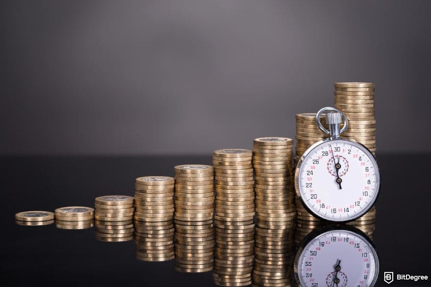 How to transfer money from one bank to another: stacks of coins and a stopwatch.