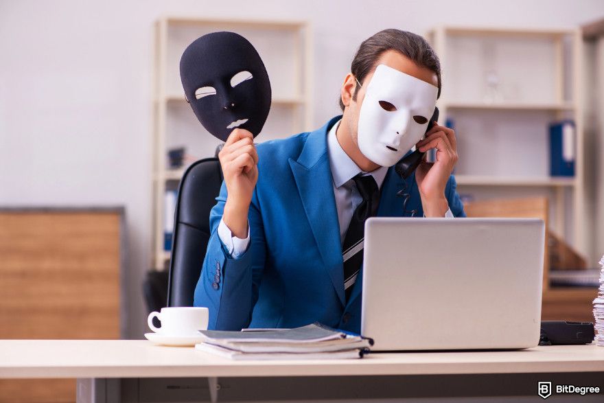 How to turn crypto into cash: a person with a mask talking with a phone.
