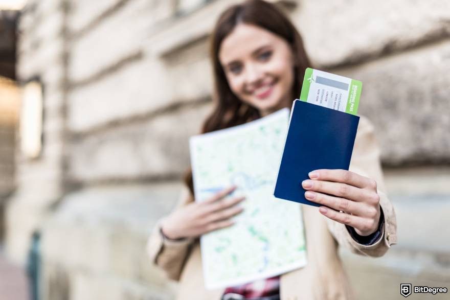 How to unfreeze cryptocurrency: a woman holding a passport.