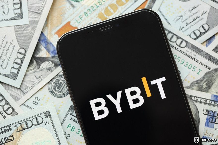 How to use AI for crypto trading: a Bybit logo on an iPhone display screen.