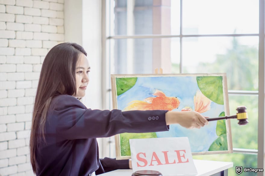 How to use DALL-E: a person finalizing an art sale.