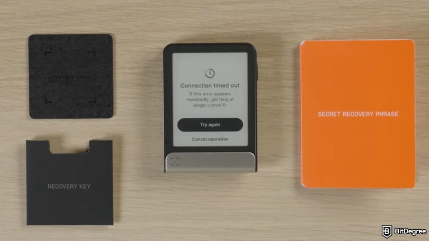How to use Ledger Recovery Key: a Ledger Flex is placed alongside Recovery Key and a secret recovery phrase sheet.