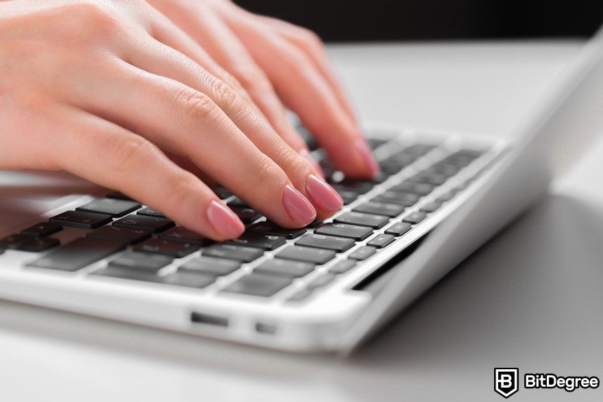 How to use Midjourney: Human hands typing on keyboard.