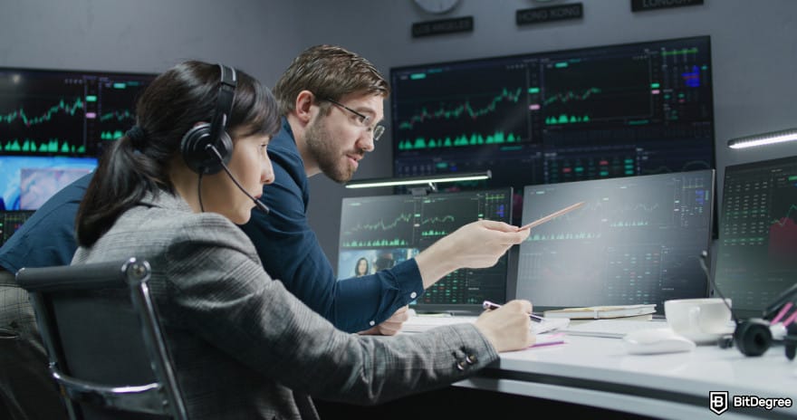 How to wire money: two people conversating while monitoring the screen.