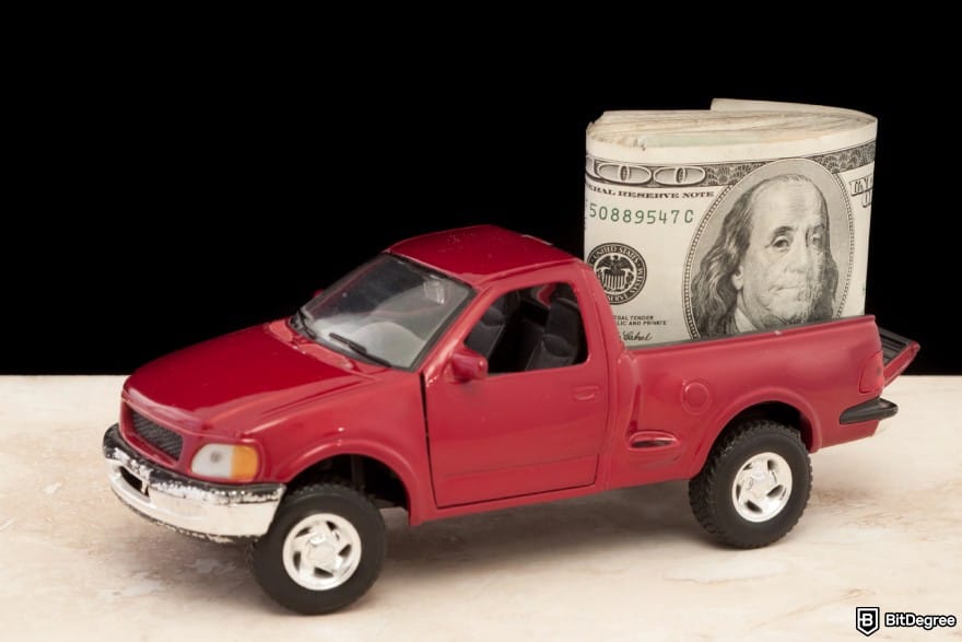 How to wire money: a truck filled with cash in the back to illustrate cash pick-up.