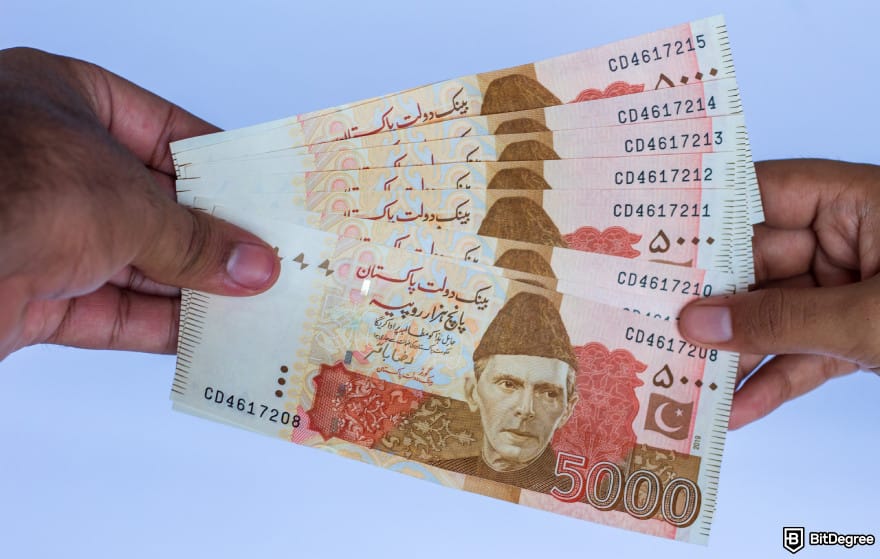 How to withdraw from Binance in Pakistan: two hands holding PKR to illustrate P2P. How to withdraw from Binance in Pakistan: two hands holding PKR to illustrate P2P.