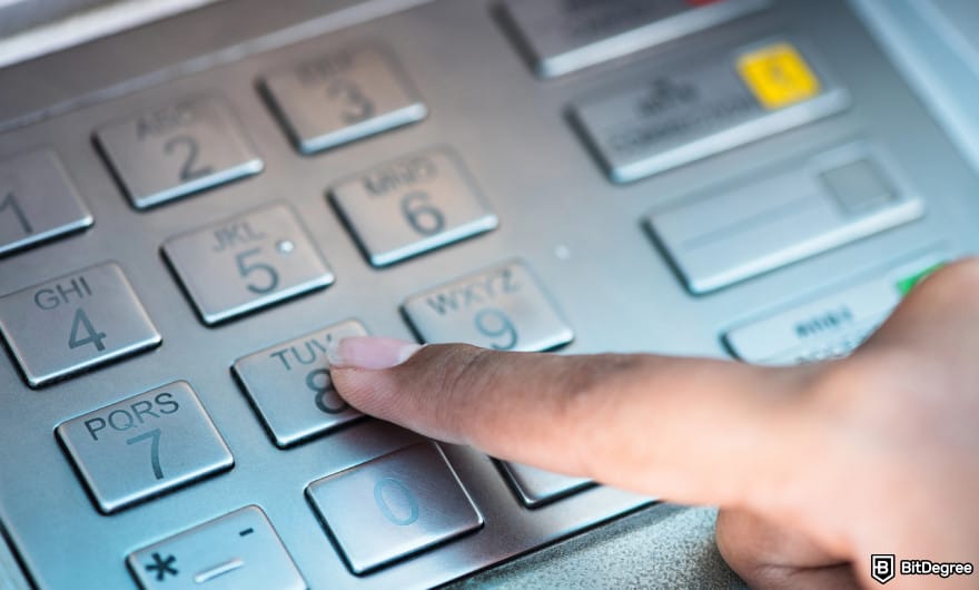 How to withdraw money from checking account: person using ATM close up. How to withdraw money from checking account: person using ATM close up.