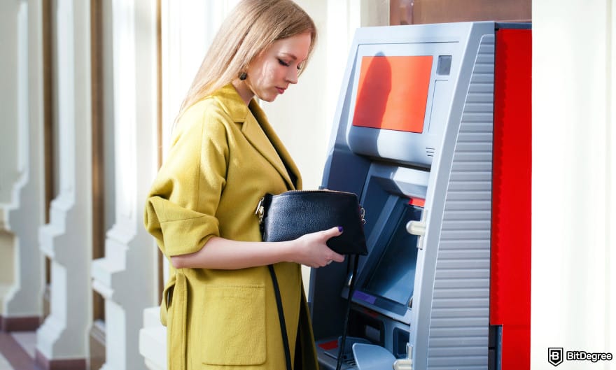 How to withdraw money from checking account: a woman using ATM. How to withdraw money from checking account: a woman using ATM.