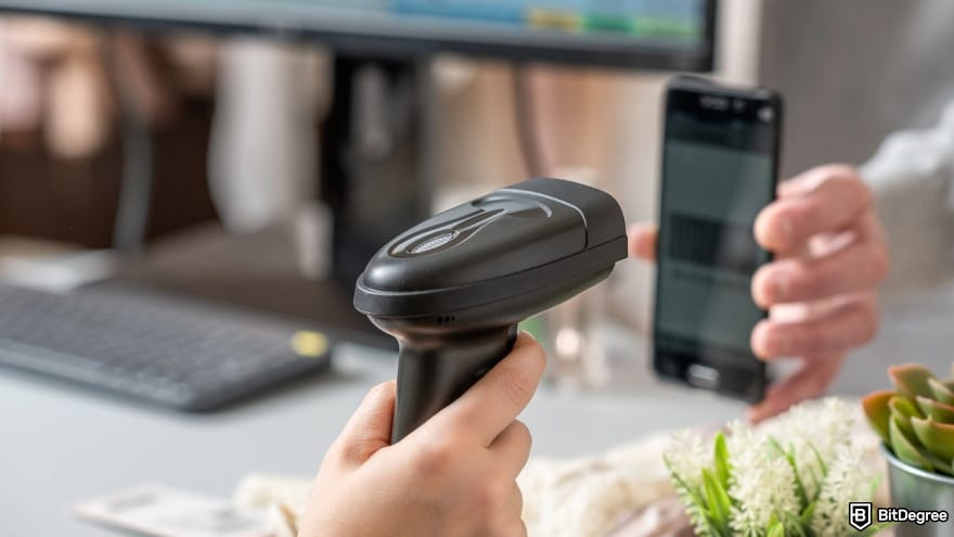 How to withdraw money from GO2bank without card: cashier scanning barcode from buyer phone.