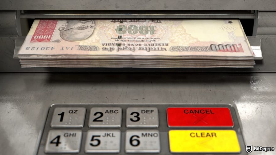 How to withdraw money from OKX in India: Indian rupee banknotes being withdrawn from an ATM. How to withdraw money from OKX in India: Indian rupee banknotes being withdrawn from an ATM.