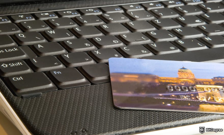 How to withdraw money from prepaid card online: card on a laptop to illustrate online transfer. How to withdraw money from prepaid card online: card on a laptop to illustrate online transfer.