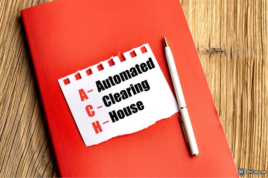 How to withdraw money from savings account: a red notebook with the acronym ACH.