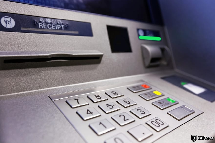 How to withdraw money from savings account: a close-up of an ATM keypad.