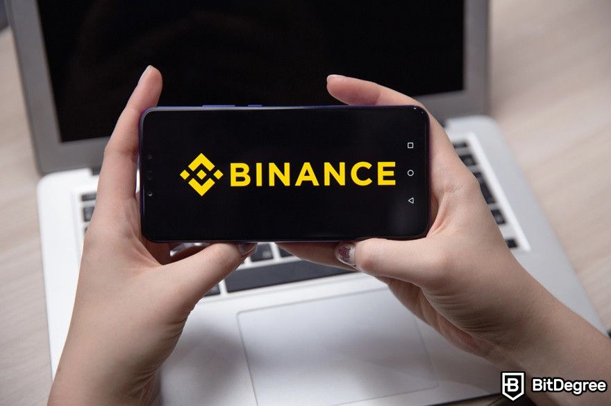 How to withdraw USDT to bank account: Binance logo on a smartphone.