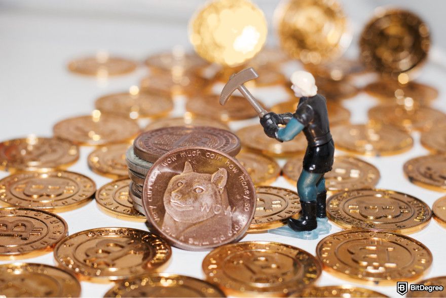 Is Dogecoin a good investment? A plastic miner figure bent over Dogecoin.