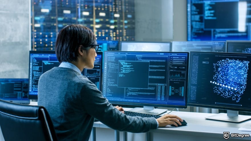 Is Kraken safe: a technical operator works at his workstation with multiple displays.