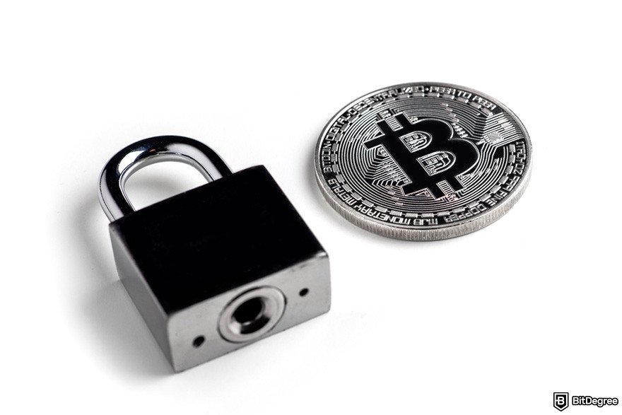 Is MetaMask safe: a silver BTC coin and a silver padlock.