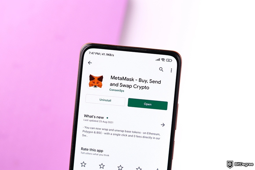 Is MetaMask safe: a mobile phone displaying the Google Play page for the MetaMask app.