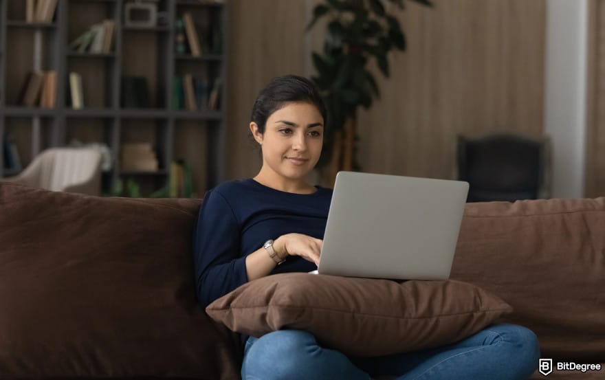 Is PayPal available in India: woman sitting and using laptop.