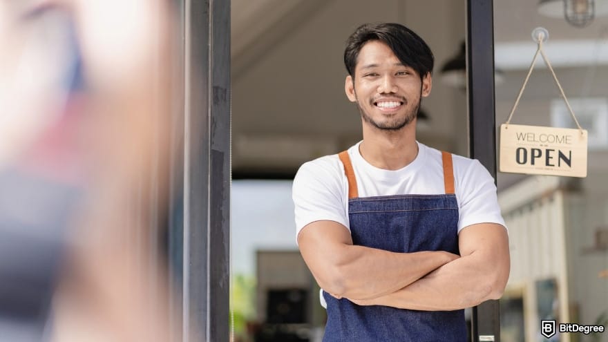 Is PayPal available in Philippines: a business owner weaning an apron.
