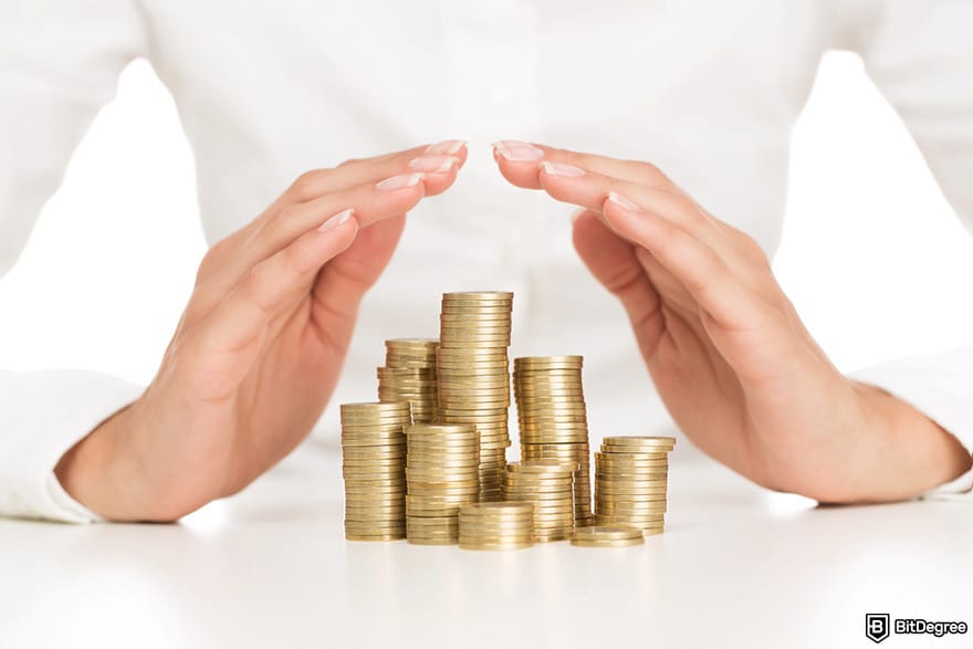 Is Robinhood safe: a person shielding stacks of coins with their hands.