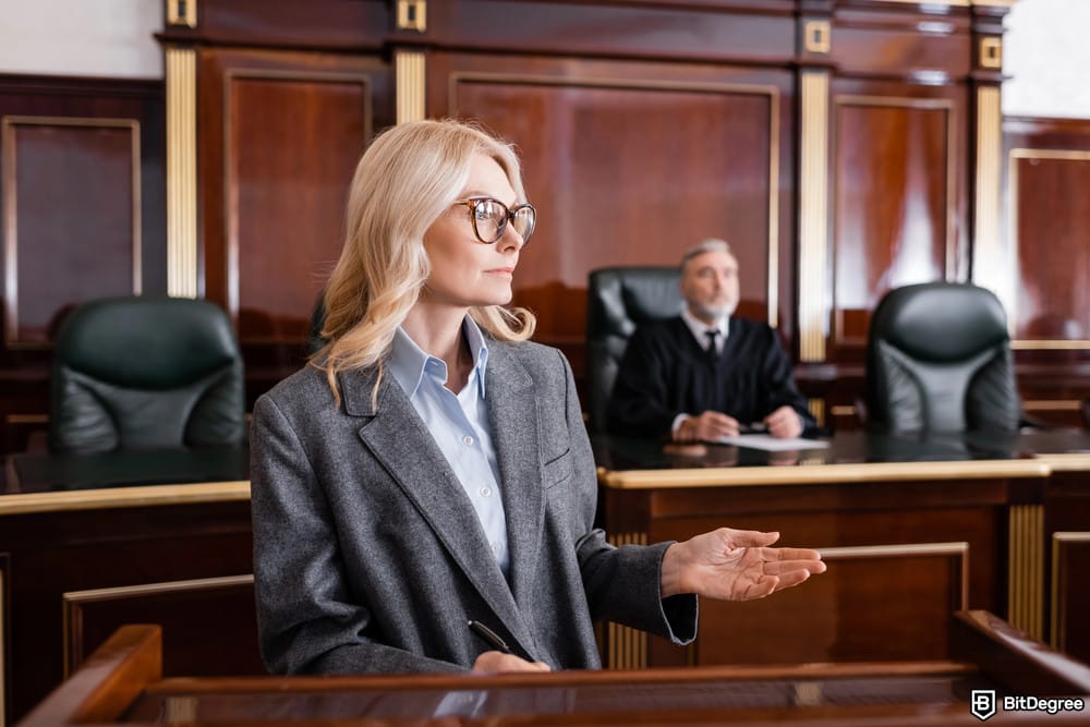 Is XRP dead: an advocate pointing with her hand.