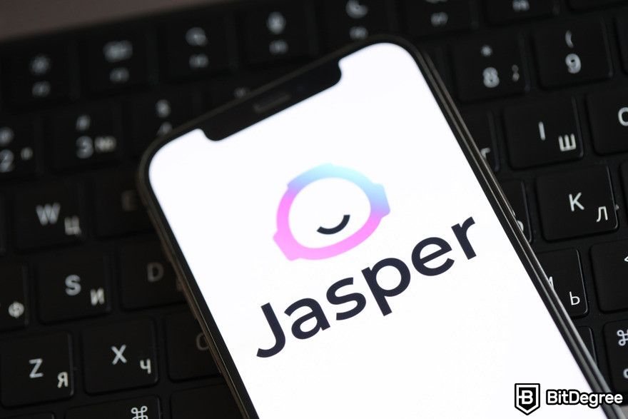 Jasper AI review: Jasper icon on phone.