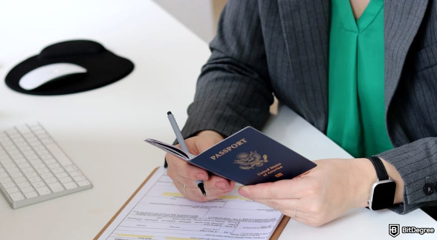 KuCoin KYC requirements: a woman reviewing her passport for identity verification.