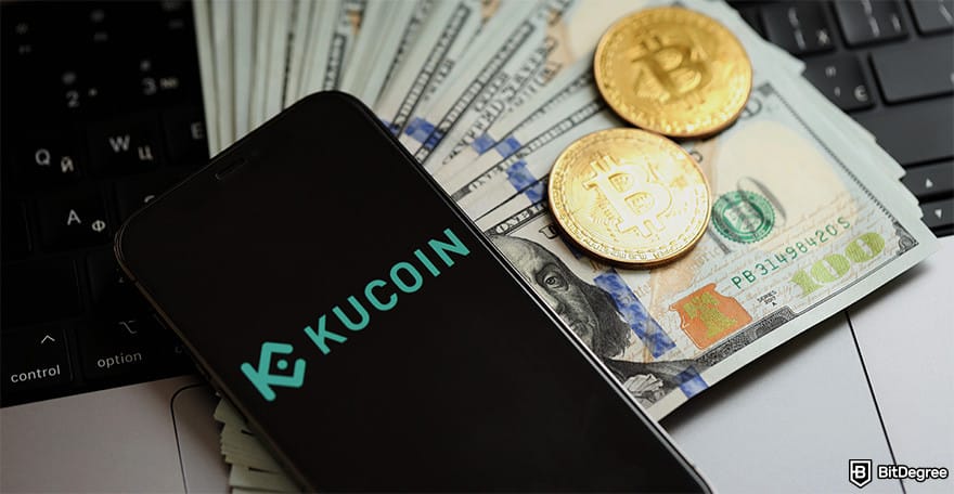 KuCoin review: a phone displaying KuCoin's logo, a stack of $100 bills, and BTC coins.