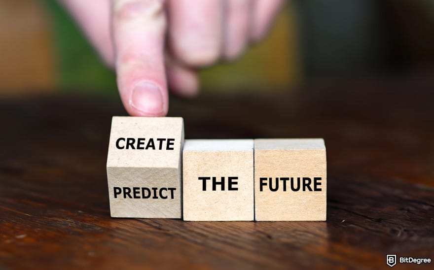 Layer 1 crypto list: a person turning blocks with the writing "create or predict the future".