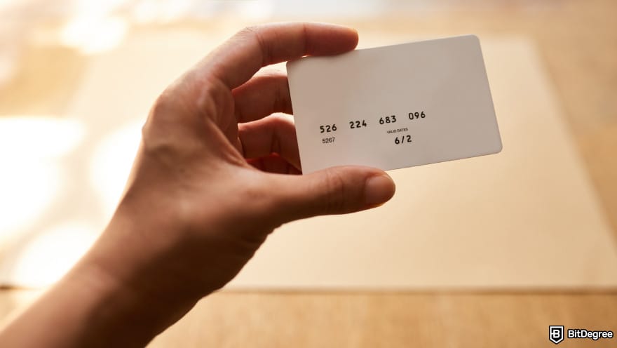Ledger alternatives: a person holding a card.