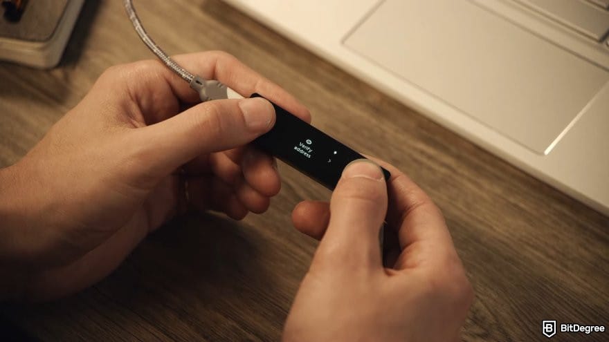 Ledger Nano X: a pair of hands holding a Ledger Nano X device.