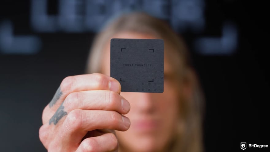 Ledger Recovery Key review: a person holding a Ledger Recovery Key card.