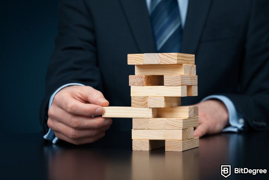 Machine learning vs AI: man playing jenga.