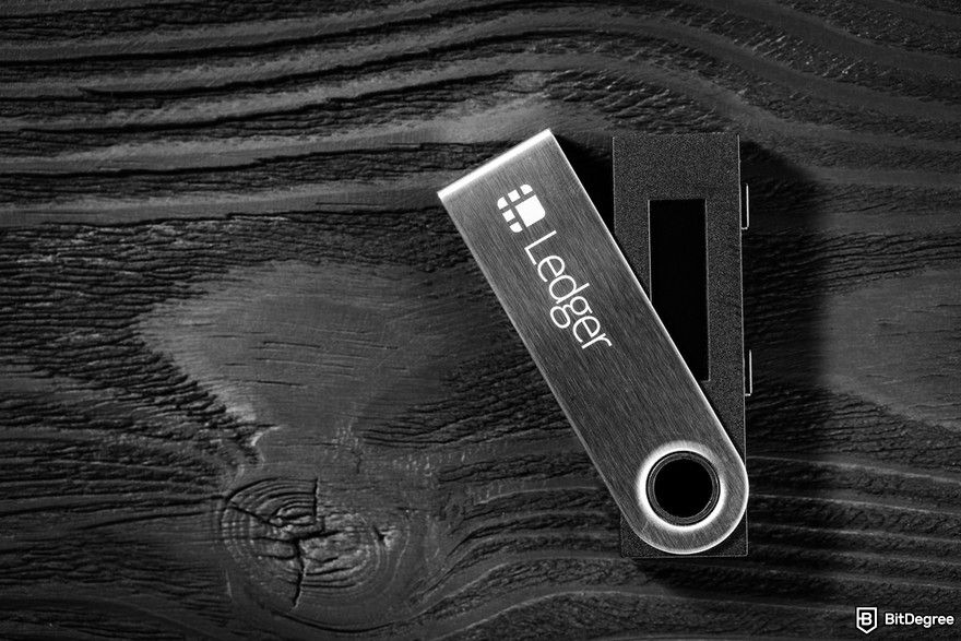 Managing multiple crypto wallets: a close-up of a Ledger device.