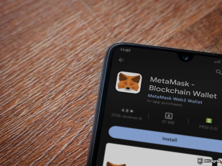 MetaMask review: a phone displaying the Google Play page for MetaMask.