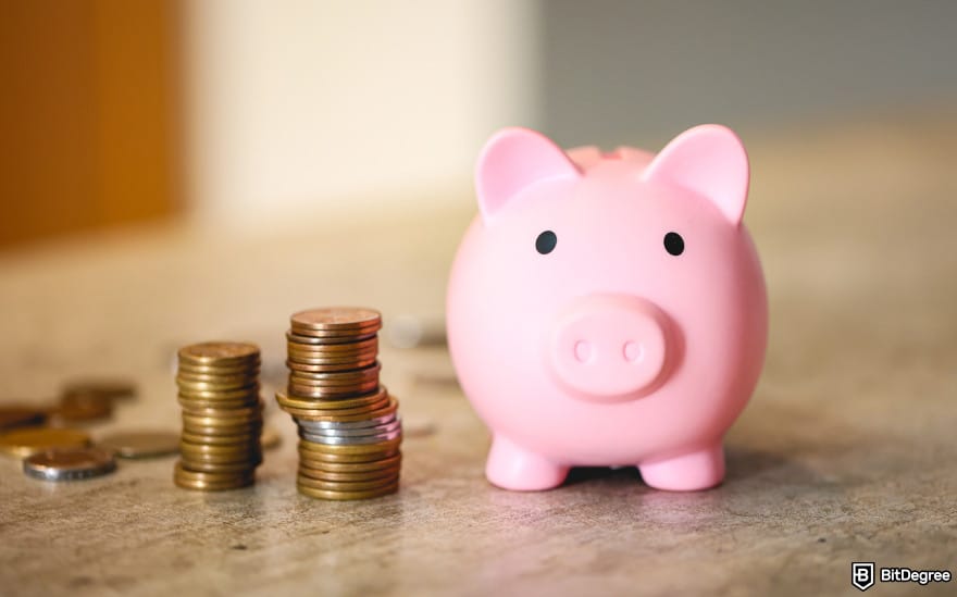 OFX alternative: a piggy bank next to coins to illustrate money transfer fees. OFX alternative: a piggy bank next to coins to illustrate money transfer fees.
