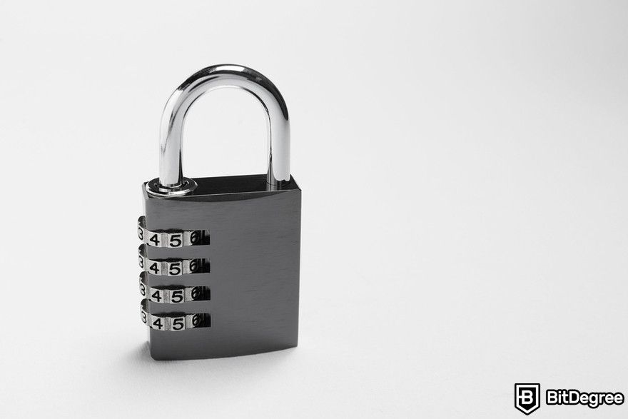 Polkadot staking: a steel combination padlock on grey background.