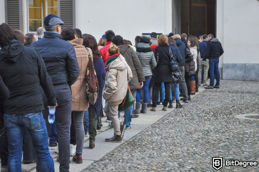 Polygon blockchain: People queueing, representing high transactions.