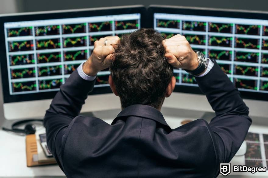 Pump and dump crypto: A man in a suit frustrated analyzing market data on multiple screens.