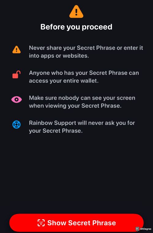 Rainbow wallet review: a pop-up showing a warning message and the Show Secret Phrase button.