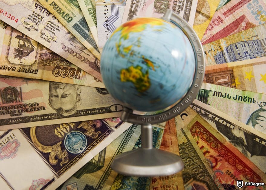 Revolut alternative: a globe on top of different banknotes.