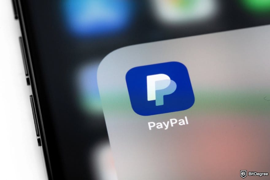 Revolut alternative: a phone displaying the PayPal app icon.