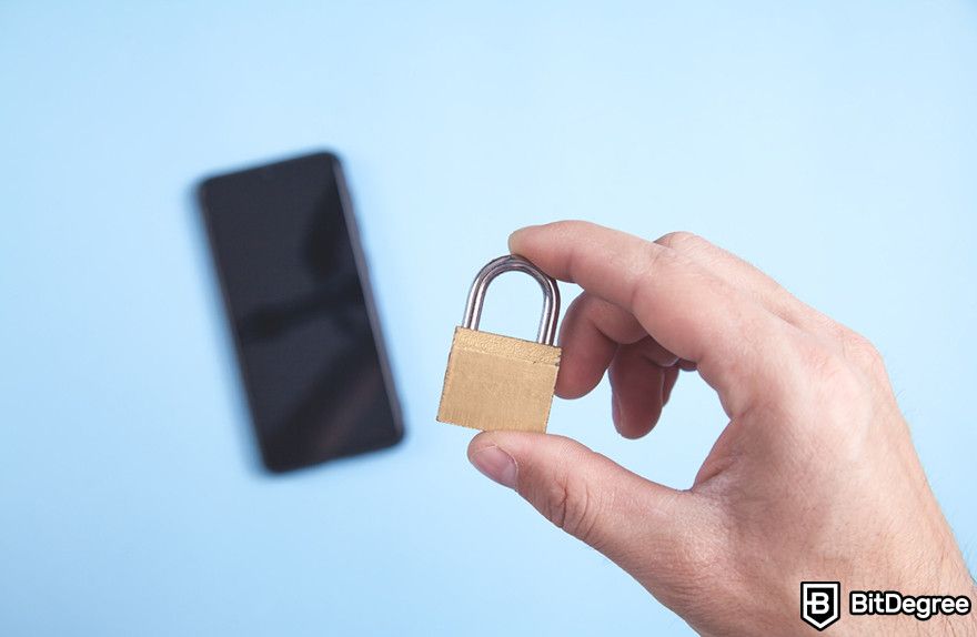 Soft token: a person holding a small pad lock with a smartphone.