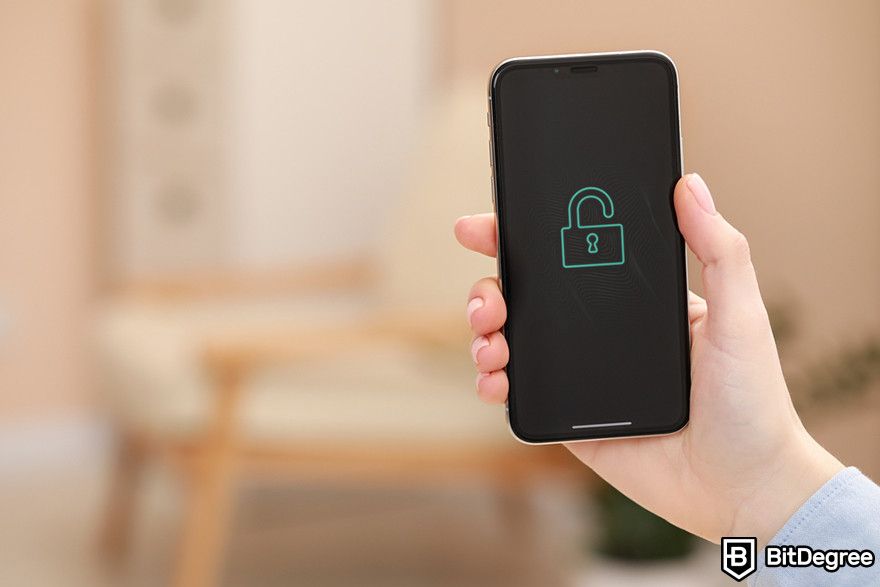 Soft token: a hand holding a smartphone with an unlocked padlock icon on the screen.